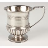 A George III silver half reeded urn shaped cup with a floral and foliate cast handle, London 1778 by