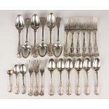 A part canteen of matched William IV and early Victorian silver King's pattern cutlery, comprising