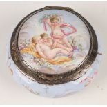 A late 19th century French silver mounted porcelain circular pillbox, the hinged lid and base