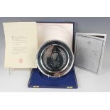 An Elizabeth II silver limited edition plate, designed by Pietro Annigoni, commemorating the
