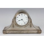An early 20th century plated mantel timepiece, the front engraved with the crest of the 52nd