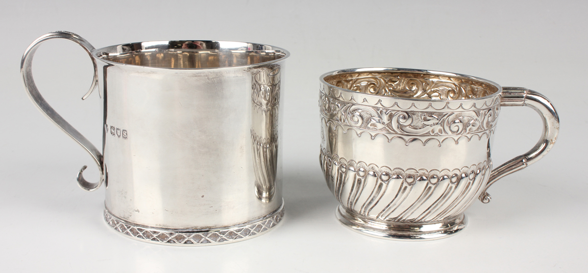 A George V silver cup of cylindrical form with scroll handle, cast with lattice decoration to handle