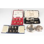 A George V silver three-piece christening set, comprising spoon, fork and faceted napkin ring,