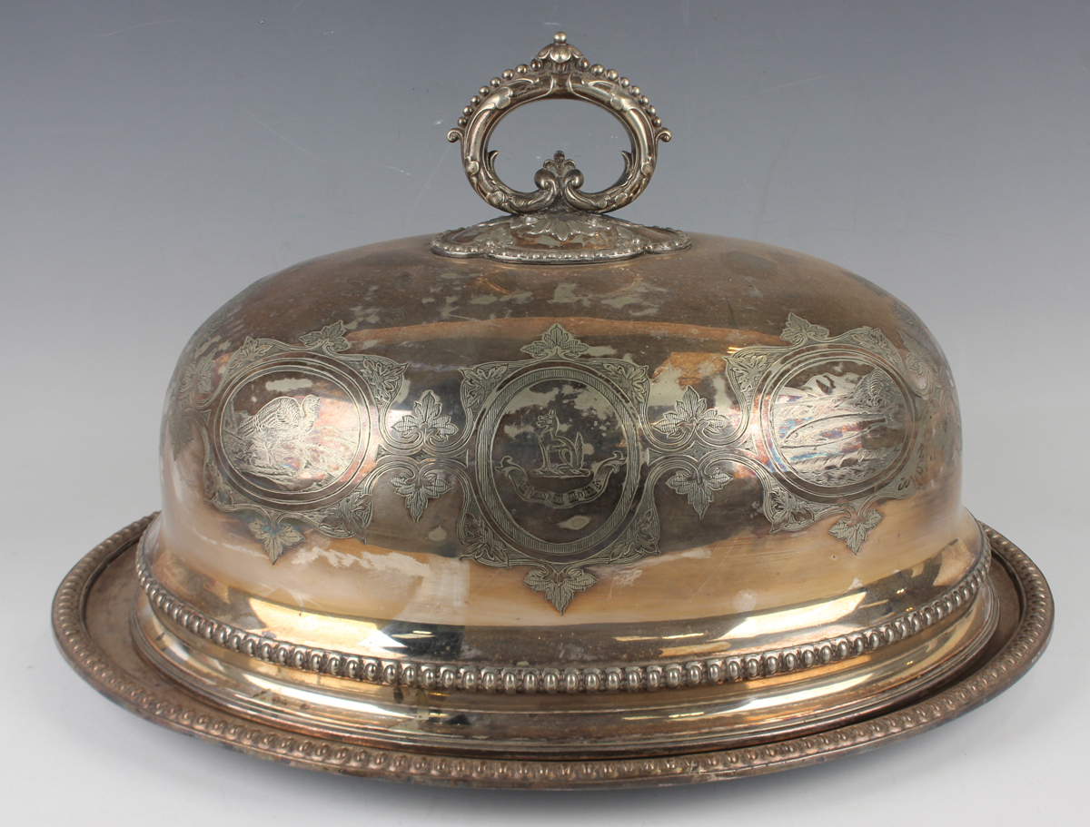 A Victorian plated meat dome with detachable scroll and beaded handle and oval meat dish, the dome