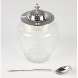 A George V silver lidded and Stourbridge glass preserve jar, the foliate capped lid with knop finial