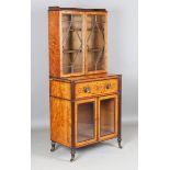 A Regency satinwood glazed secrétaire bookcase, the galleried top above two astragal glazed doors,