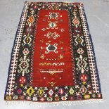 A Turkish kelhim prayer rug, mid-20th century, the red field with a column of hooked palmettes,