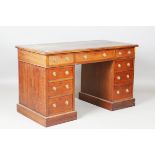 A late Victorian walnut twin pedestal desk, fitted with an arrangement of nine drawers, height 72cm,