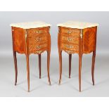 A pair of mid-20th century French kingwood and foliate inlaid bedside chests, each shaped marble top