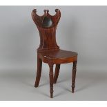 A Regency mahogany hall chair, the shaped back painted with an initialled reserve, height 91cm,