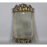 A 20th century Queen Anne chinoiserie style wall mirror, decorated in gilt with figures on a black