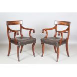 A set of eight Regency bar back dining chairs with ropetwist centre rails and reeded frames, the