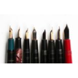 A group of eight fountain pens, including four Conway Stewart, Parker Slimfold and two other
