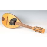 A mid-20th century Neapolitan mandolin, together with a reproduction medieval style breast plate,