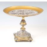 A mid-19th century Elkington style plated copper and brass tazza, the circular dish top decorated in