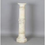 A late Victorian carved alabaster sectional pedestal, the stop fluted column carved with a band of
