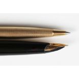 A 9ct gold cased Parker 61 fountain pen and a Parker 9ct gold cased ballpoint pen.Buyer’s Premium