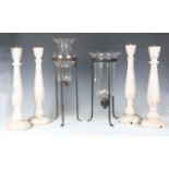 A set of four painted wooden pricket candlesticks, height 45cm, and two glass and wrought metal