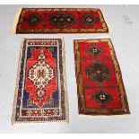 A small South-west Persian rug, 102cm x 51cm, together with two Turkish rugs.Buyer’s Premium 29.