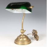 A mid-20th century brass and green glass adjustable desk lamp, height 40cm.Buyer’s Premium 29.4% (