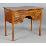 A George III mahogany side table, fitted with three drawers, height 75cm, width 92cm, depth 52cm.