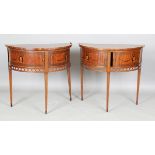 A pair of late 18th/early 19th century Continental mahogany demi-lune side cabinets, each