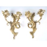 A pair of 18th century French Rococo gilt bronze twin branch wall sconces, height 45cm.Buyer’s