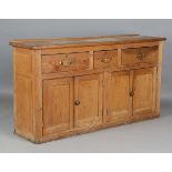 A late Victorian pine dresser base, height 90cm, width 165cm, depth 43cm.Buyer’s Premium 29.4% (