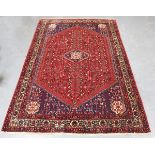 An Abadeh carpet, South-west Persia, late 20th century, the deep red field with a lozenge medallion,