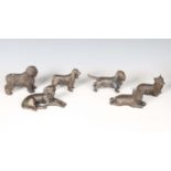 A group of six modern patinated cast bronze models of dogs, including a standing English sheepdog,