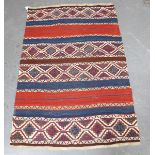 A Turkish kelhim rug, mid-20th century, the polychrome banded field with rows of stepped guls, 151cm