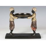 A 20th century cold painted cast bronze figural tazza, modelled as two standing boys supporting a