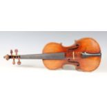 A violin with striped two-piece back, bearing interior label detailed 'Antonius Straduarius...', the