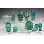 Seven soda glass dump paperweights, 19th century, each with internal floral decoration, highest