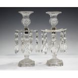 A pair of clear cut glass lustres, 19th century, the wrythen cut baluster stems on circular feet and