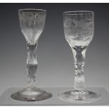 A faceted stem wine glass, mid-18th century, the ogee bowl engraved with flowers and foliage above a
