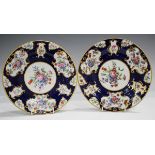 A pair of Barr, Flight & Barr Worcester plates, 1804-13, painted with a central floral panel against