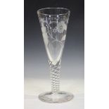 A large Jacobite Revival wine glass, early 19th century, the drawn funnel bowl engraved with a