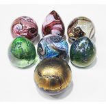 Three Isle of Wight glass spherical gemstone paperweights in amethyst, aquamarine and topaz, a