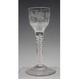 A Jacobite type double series opaque twist stem wine glass, circa 1765, the ogee bowl engraved
