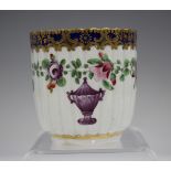 A Worcester fluted coffee cup, circa 1775, painted in the atelier of James Giles with an urn beneath