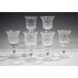 A set of six Cumbria Crystal large wine glasses with cut diamond and fan detail, on baluster