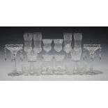 Four Edinburgh Crystal Thistle champagne flutes and four matching small wines, together with a