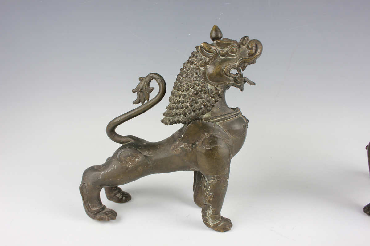 A pair of South-east Asian bronze models of Buddhistic lions, probably Nepalese, late 19th - Image 13 of 13