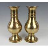 A pair of Chinese gilt bronze altar vases, 20th century, each baluster body with horizontal ribbed