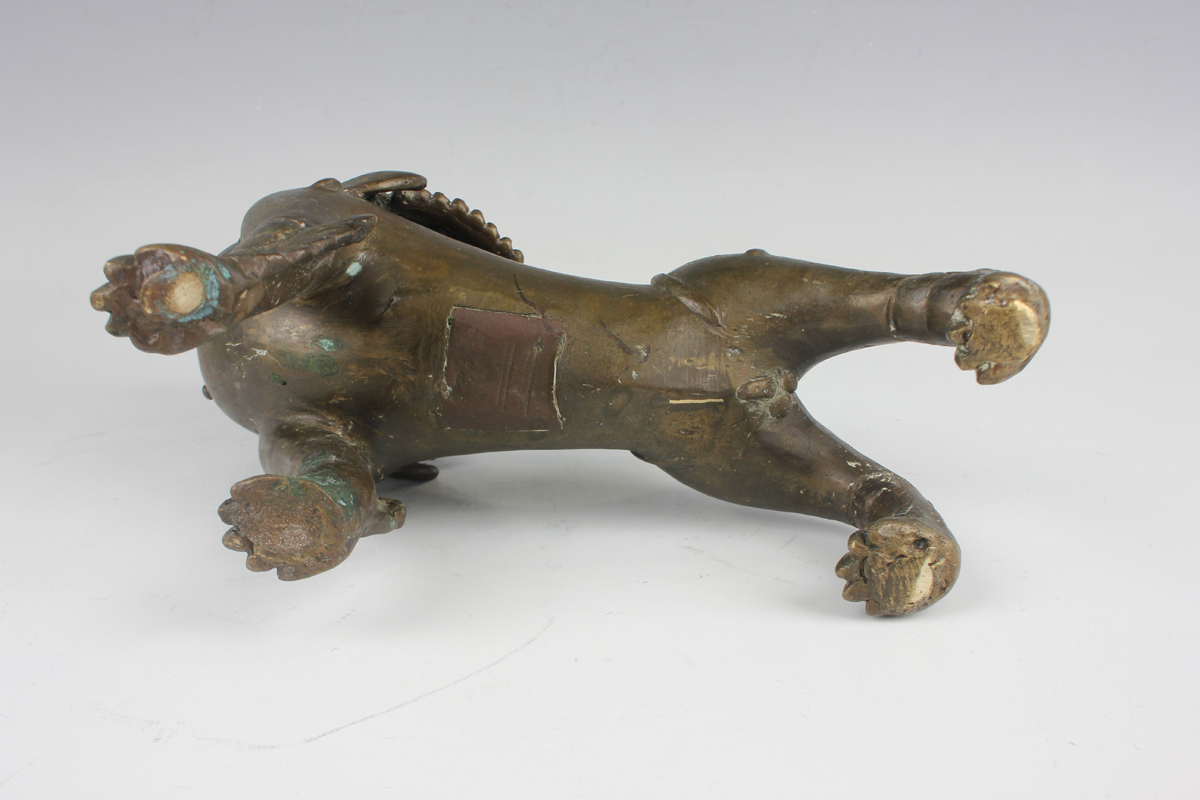 A pair of South-east Asian bronze models of Buddhistic lions, probably Nepalese, late 19th - Image 4 of 13