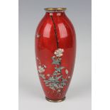 A Japanese cloisonné vase, Meiji period, of elongated ovoid form, decorated with a sparrow flying
