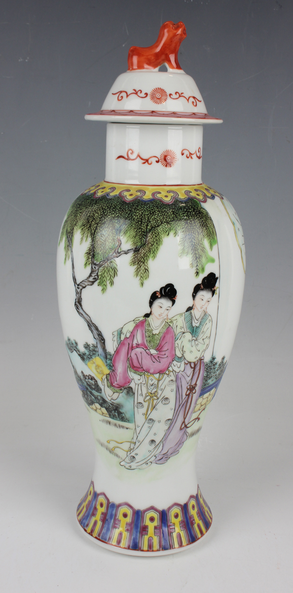 A Chinese famille rose porcelain vase and cover, Republic period, the baluster body painted with two