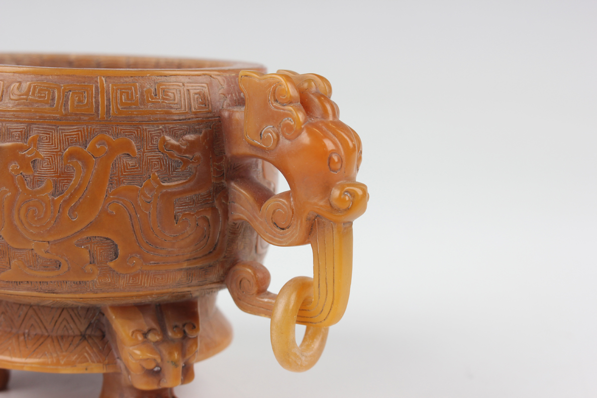 A Chinese archaistic butterscotch coloured soapstone tripod censer and cover, late Qing dynasty, the - Image 15 of 30