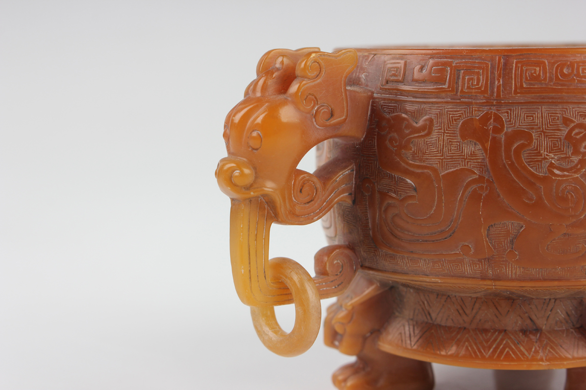 A Chinese archaistic butterscotch coloured soapstone tripod censer and cover, late Qing dynasty, the - Image 11 of 30